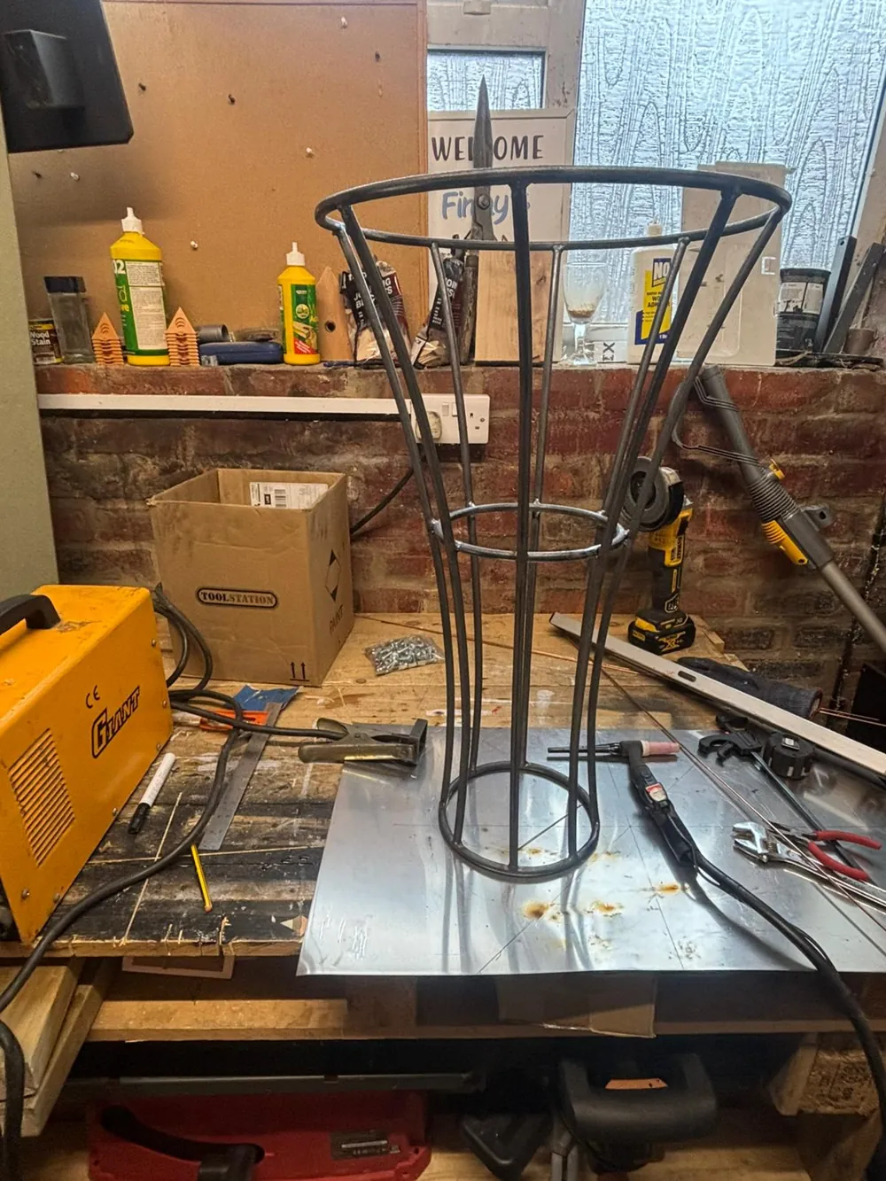 The tapered steel stem the sphere sits on, under construction.