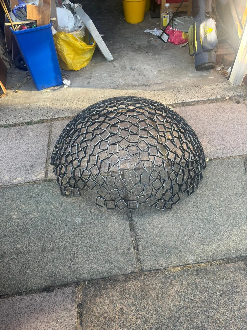 An early dome of welded steel mesh taking shape.