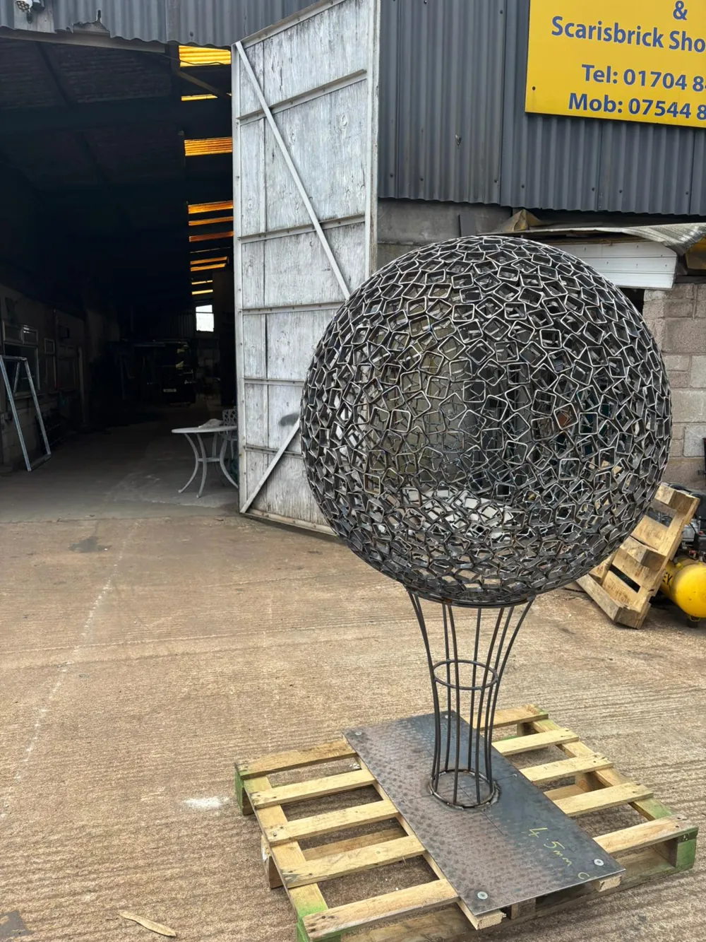 The sphere mounted on its stem in bare steel, before finishing.
