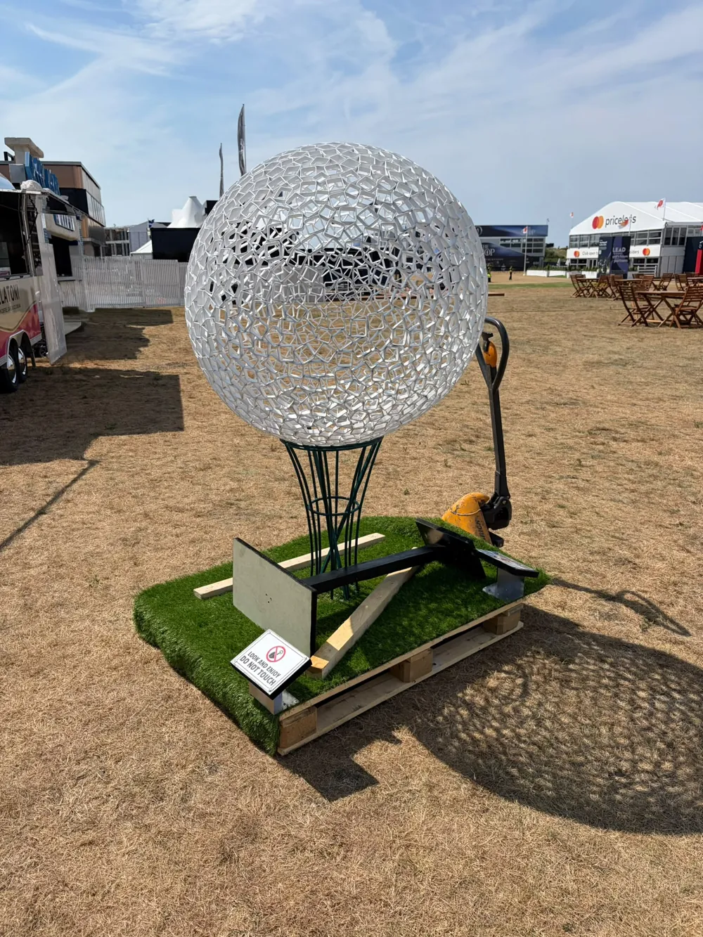 Life of the North West on display at The Open, on the grass against a blue sky.